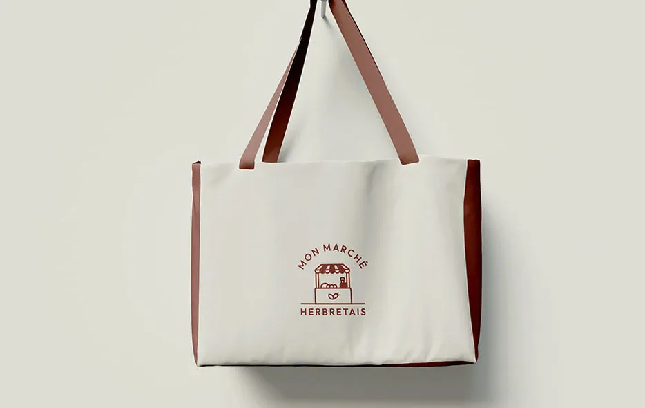 Logo « Mon marché herbretais » sur un sac en toile, créé pour JMR